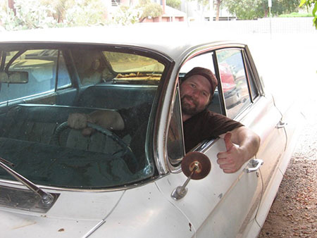 Dr. Dustin Yates giving thumbs up from car