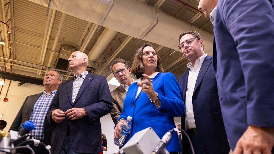 Members of Nebraska’s congressional delegation look on as Sen. Deb Fischer (center) discusses precision agriculture technologies with (right) Joe Luck, professor of biological systems engineering. 