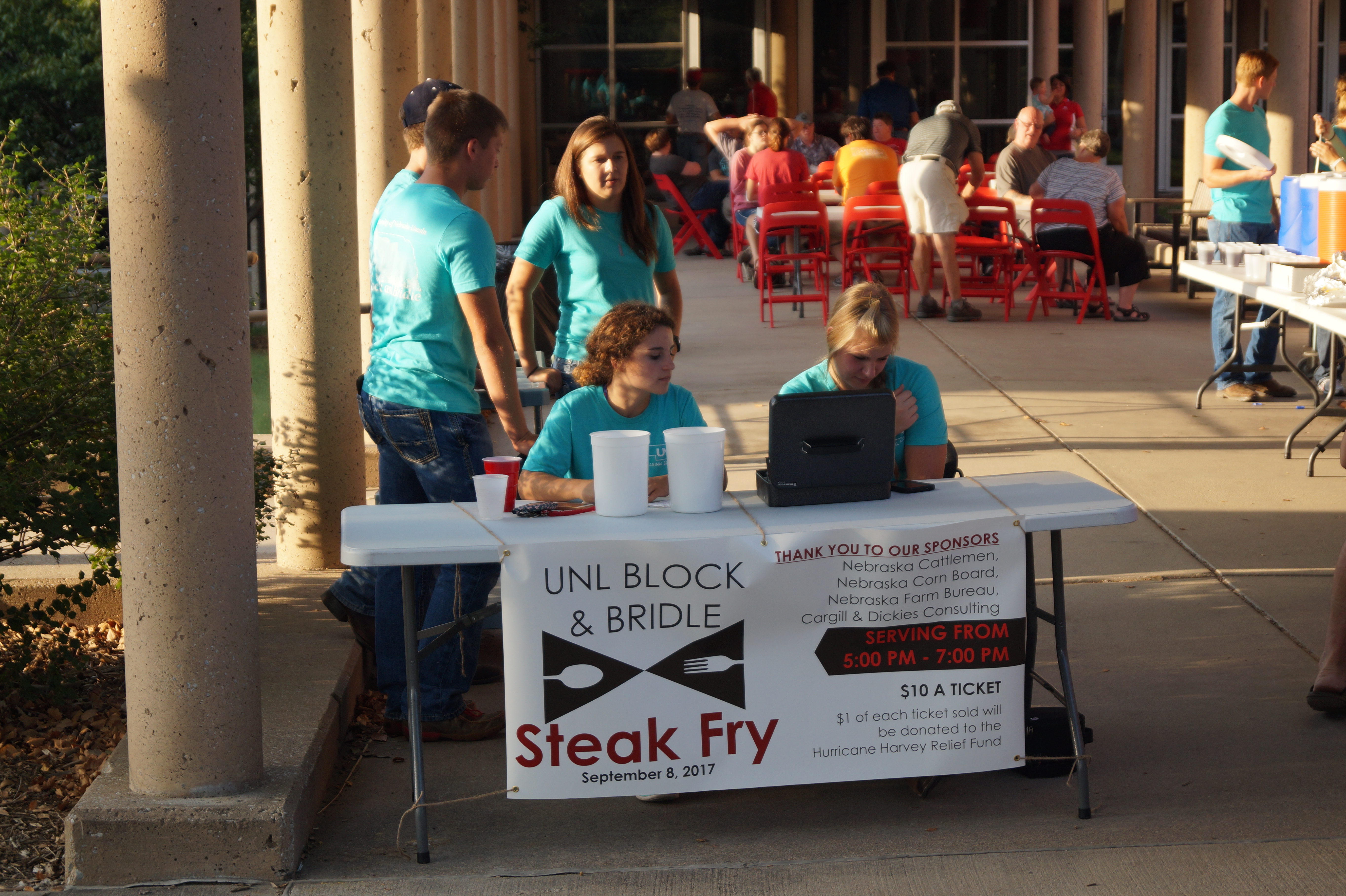 Students at the Steak Fry registration table