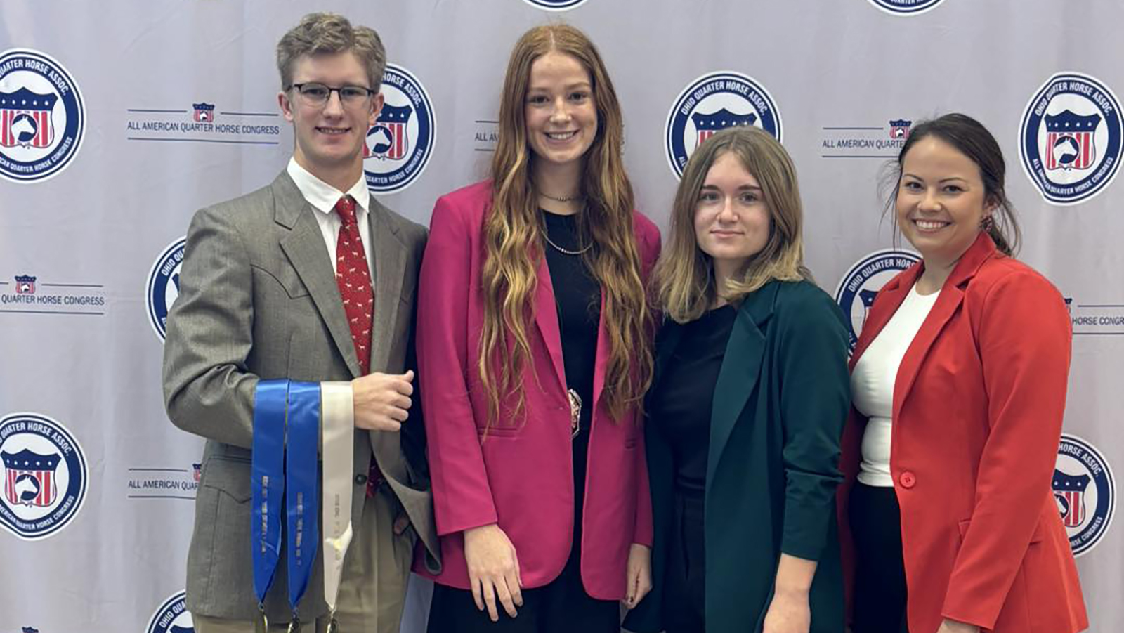 (L-R): Greg Treffer, Ella Eidson, Elle Lunsford, and assistant coach Sarah Vos