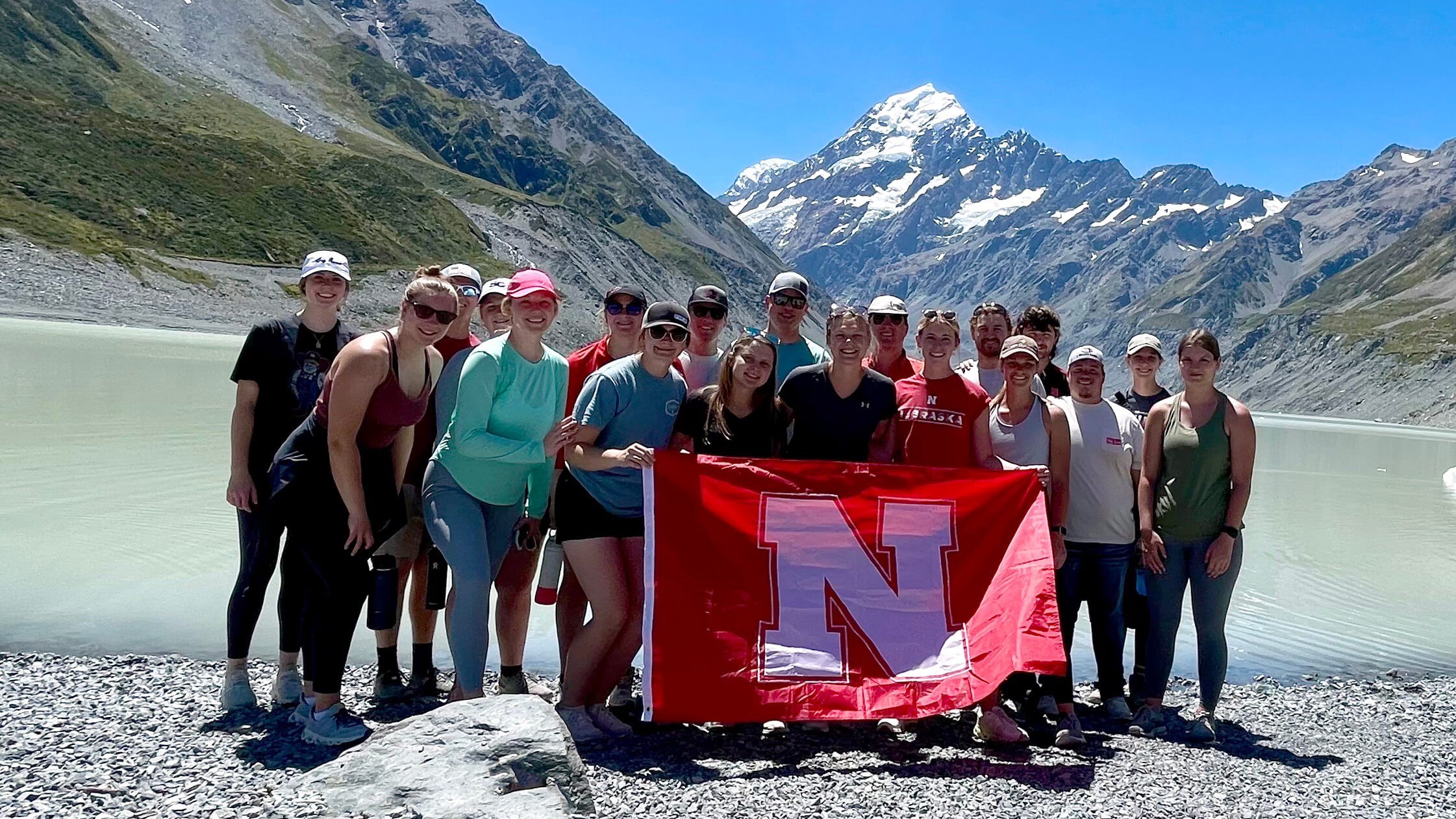 group of unl students posing in front of mountains