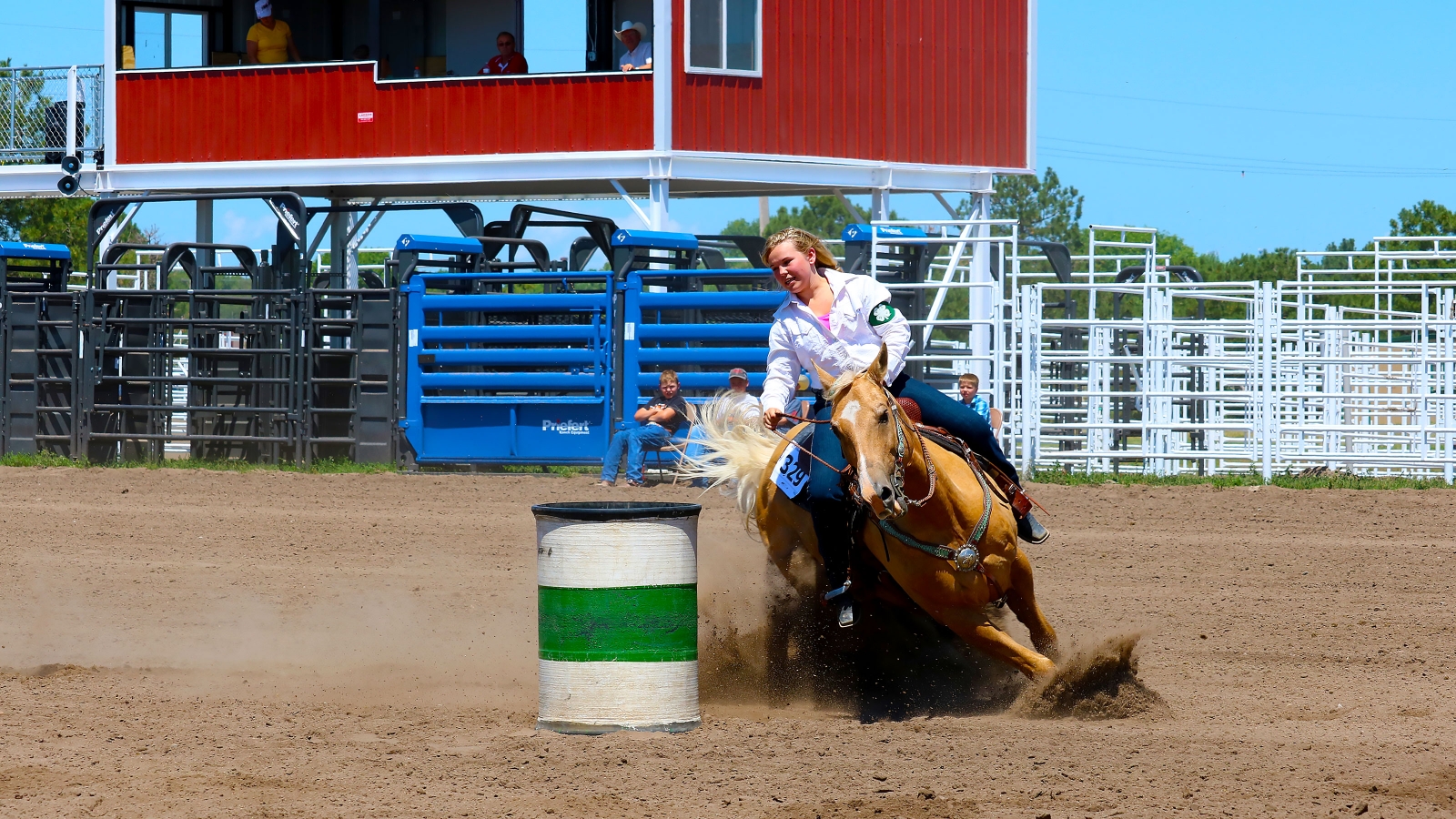 a state horse show competitor competing in barrel racing