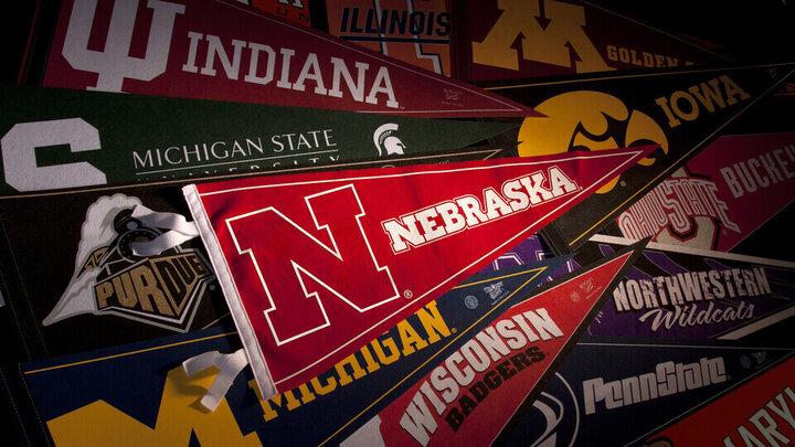 A pile of pennants from schools in the Big Ten Conference