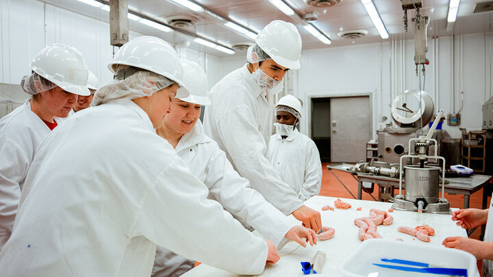  Students were encouraged to participate in the sausage-making process to further understand the lessons. UNL Meat Science club had a Sausage Making 101 course in the Animal Science Complex. February 28, 2022. Photo by Jonah Tran / University Communication. 