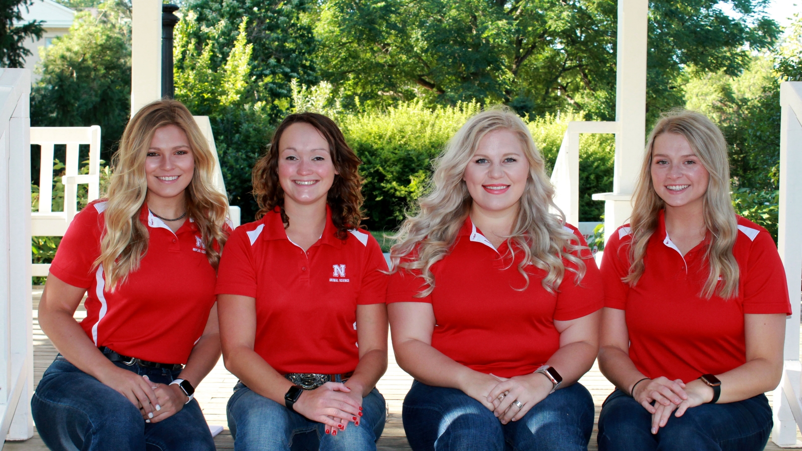 Four Animal Science Ambassadors pose side by side.